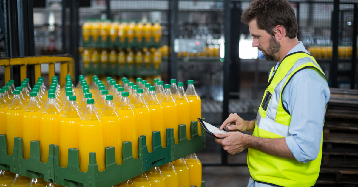 U.S. softdrink manufacturing factory showing a worker who are maintaining record of juice bottles