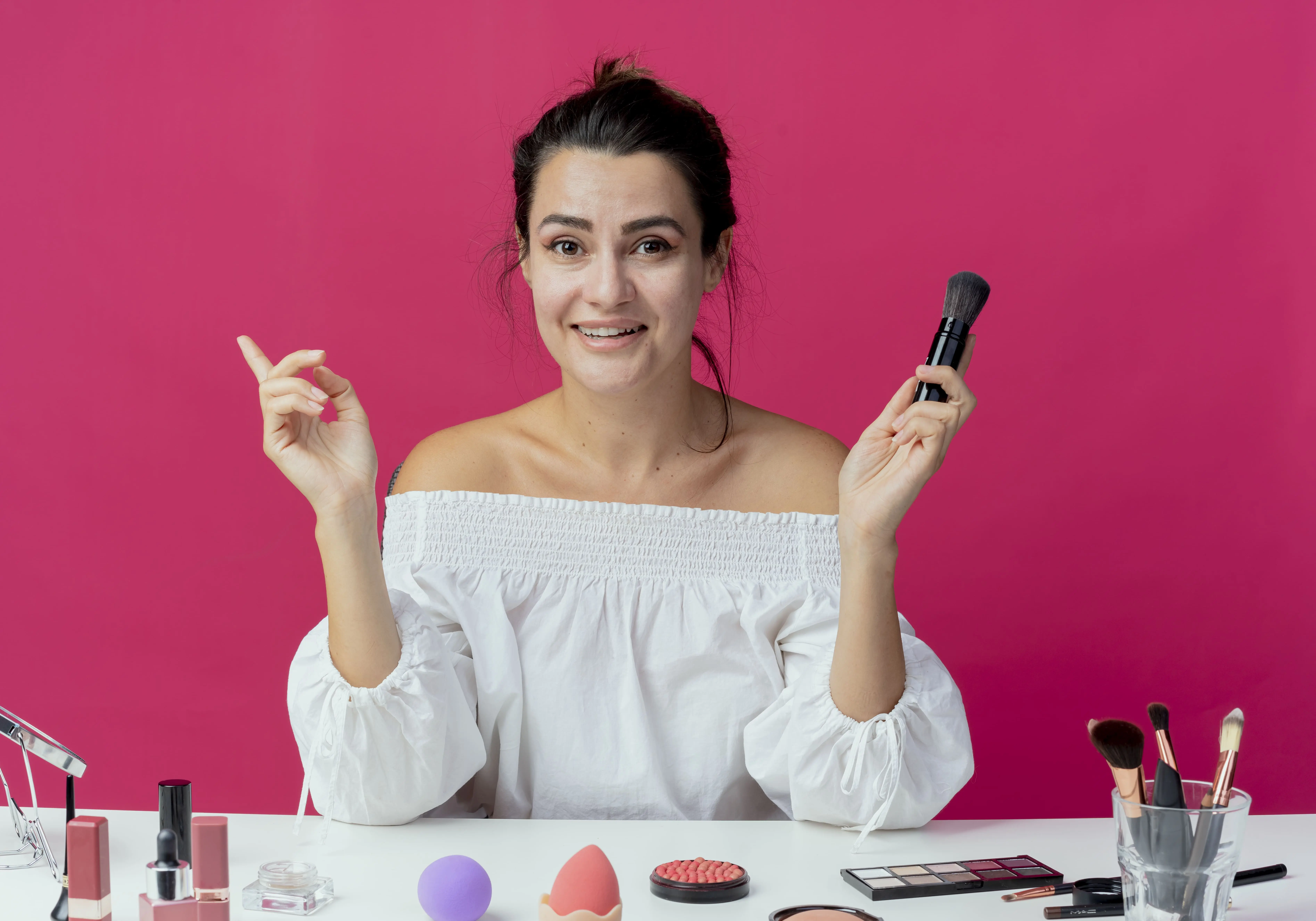 a girl showing her makeup table along with cosmetics