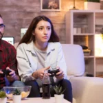 a couple enjoying video games with gaming consoles