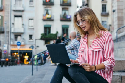 young UK based woman working on laptop