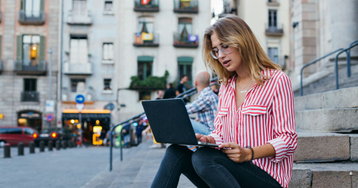 young UK based woman working on laptop